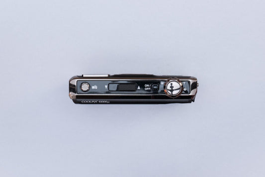 Nikon Coolpix S1000pj Projector Compact Digital Camera (Black)